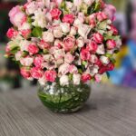 A vase of natural spherical roses